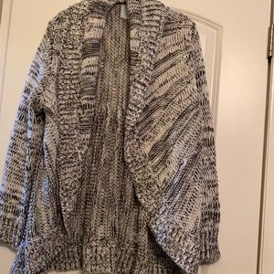 Will be donated 10/01. 
Oversized cardigan with thick collar.